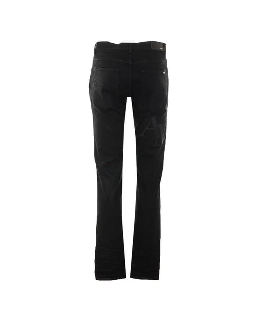 Amiri Black Logo-Patch Waxed Jeans for men