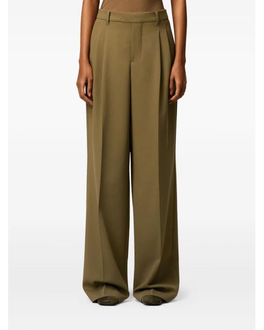 Pantalones anchos con detalle de etiqueta AMI de color Green