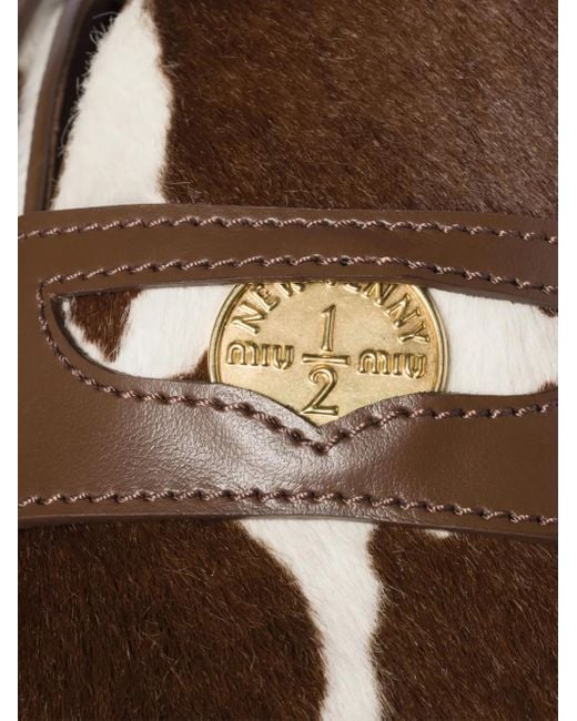 Mules Con Logo di Miu Miu in Marrone Lyst