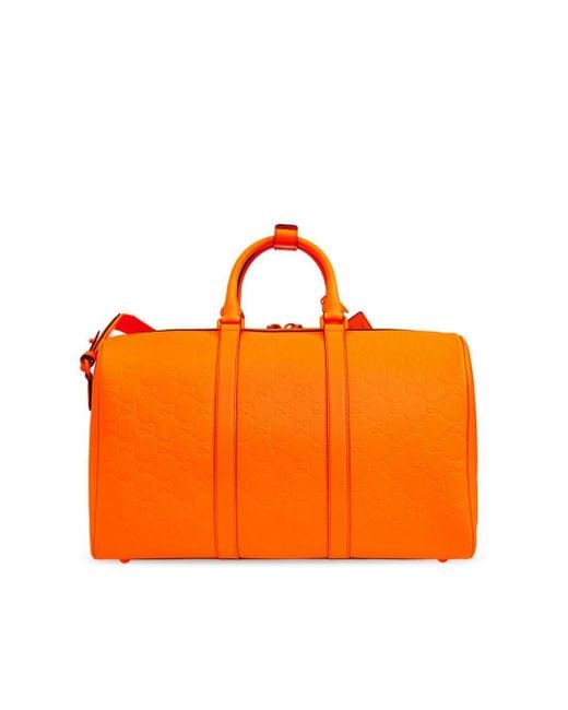 Gucci Medium Gg Rubber-Effect Duffle Bag in Orange for Men