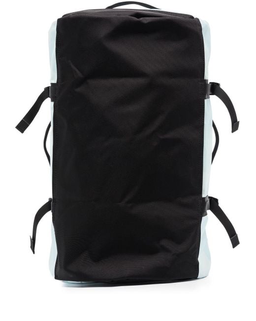 The North Face X Kaws Basecamp Duffle Bag in Blue for Men Lyst Canada