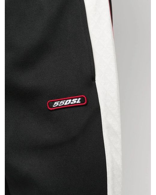 DIESEL Black Logo-Patch Tapered Track Pants for men