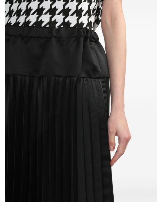 Jupe mi-longue à design plissé Comme des Garçons en coloris Black