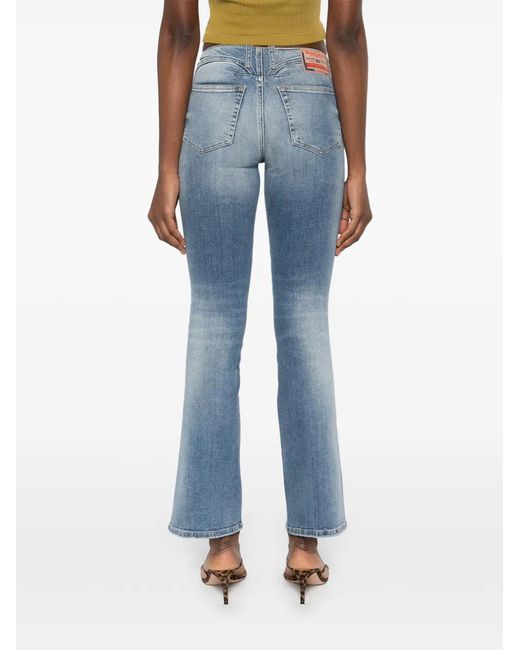 DIESEL Blue Faded Denim Jeans With Flared Silhouette