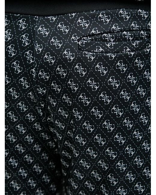 Guess Black Logo-Print Trousers for men