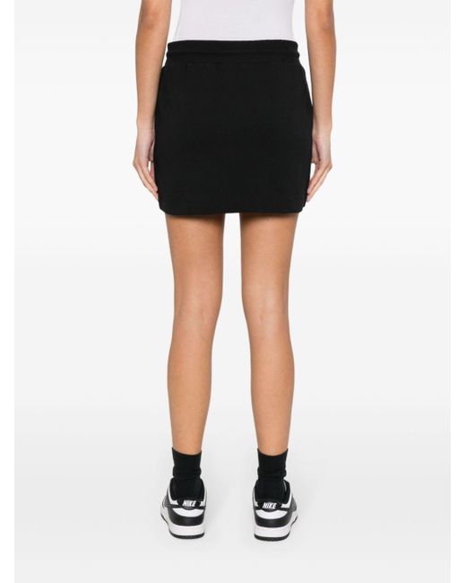 Minifalda con logo estampado Versace de color Black