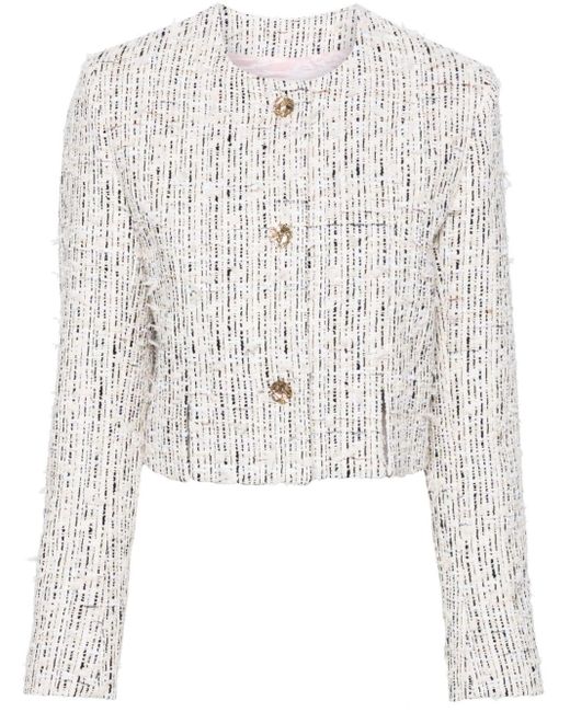 Veste en tweed à boutons embossés Nina Ricci en coloris White