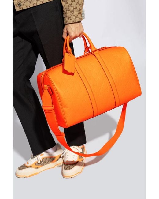 Gucci Medium Gg Rubber-Effect Duffle Bag in Orange for Men Gucci Medium Gg Rubber-Effect Duffle Bag in Orange for Men
