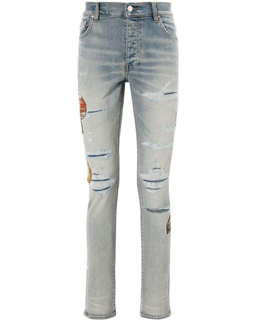 Jeans Travel Patch Repair skinny con applicazione di Amiri in Blue da Uomo
