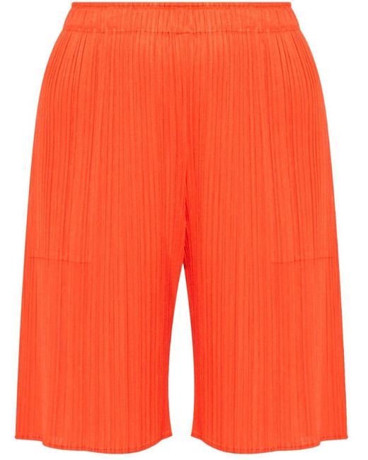 Shorts Miyake plissé di Pleats Please Issey Miyake in Orange