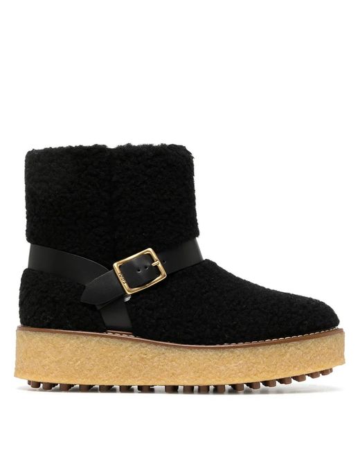 Tod's Black Platform Shearling Ankle Boots