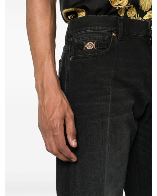Jeans Medusa con applicazione di Versace in Black da Uomo