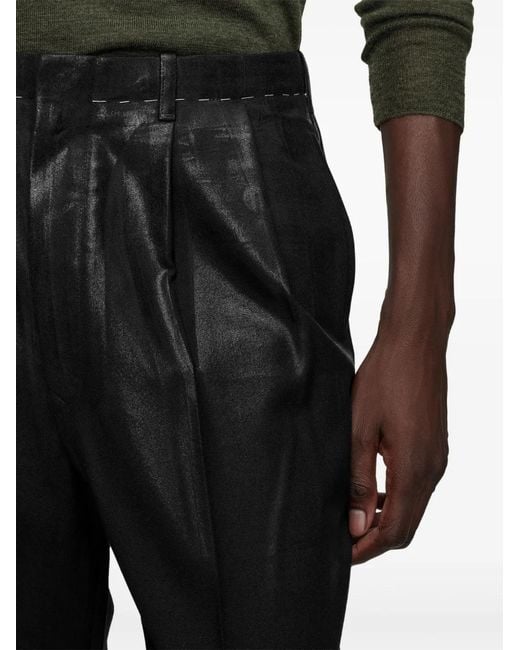 Maison Margiela Black Pleated Coated-Finish Trousers for men