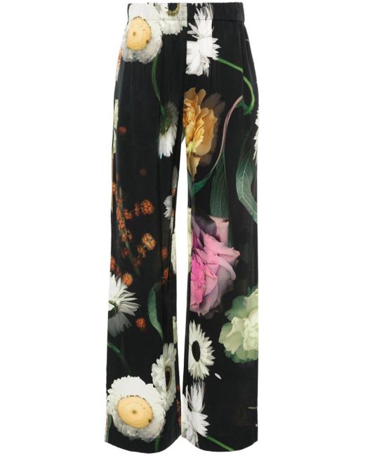Pantalones con estampado floral Stine Goya de color Black