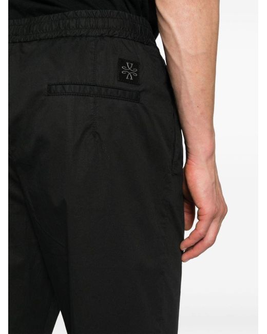 Pantaloni affusolati con placca logo di Jacob Cohen in Black da Uomo