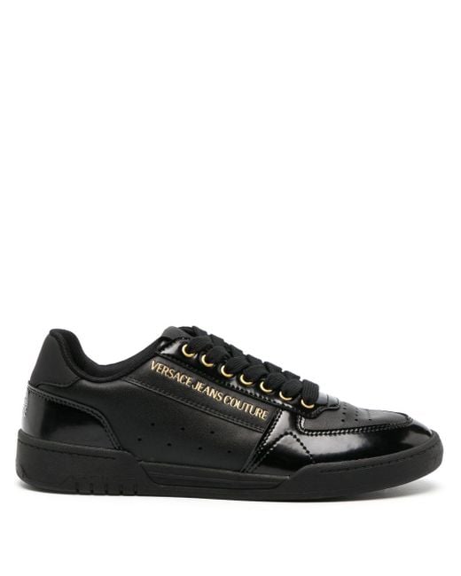 Sneakers con logo goffrato di Versace in Black da Uomo