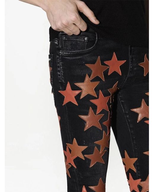 Amiri Black Star-Patch Jeans for men