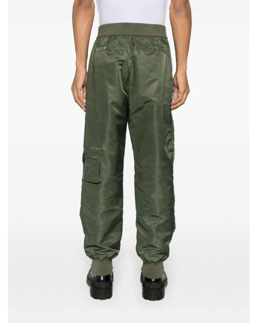 Pantaloni con logo inciso di Alexander McQueen in Green da Uomo