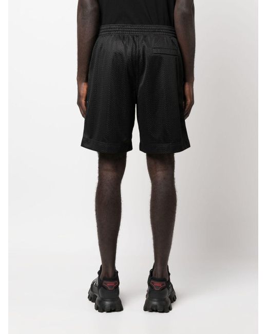 Givenchy Black Logo-print Perforated Running Shorts for men