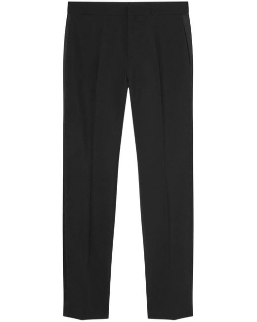 Pantalones ajustados con aplique del logo Versace de hombre de color Black
