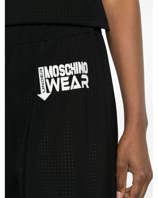 Pantalon ample à logo imprimé Moschino en coloris Black