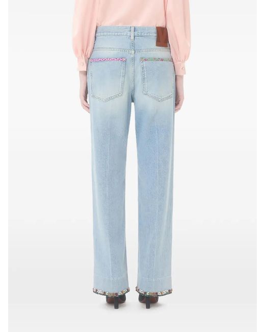 Valentino Garavani Blue Floral-Hem Faded Jeans