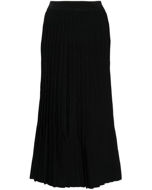 Jupe plissée en soie à motif en jacquard Balenciaga en coloris Black