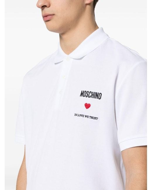 Polo à slogan brodé Moschino pour homme en coloris White