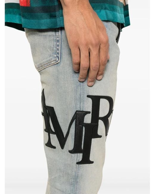 Amiri Blue Staggered Logo Skinny Jeans For for men