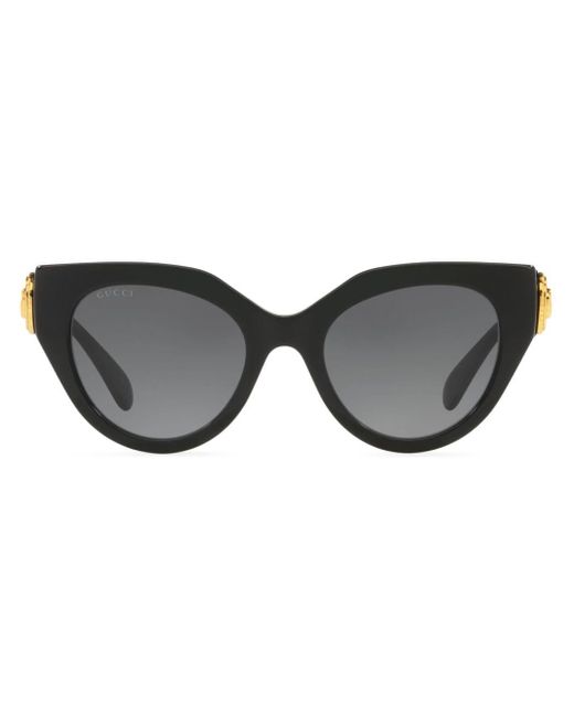 Gafas de sol cat eye con placa del logo Gucci de color Black