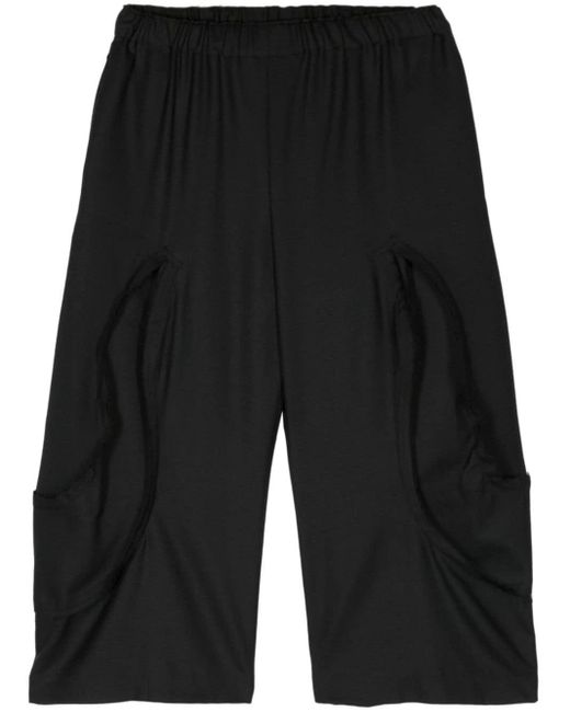 Raw-cut panelled cropped trousers Comme des Garçons en coloris Black