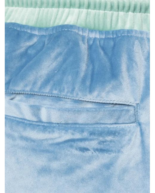 God's Masterful Children Blue Velvet Tapered Trousers for men