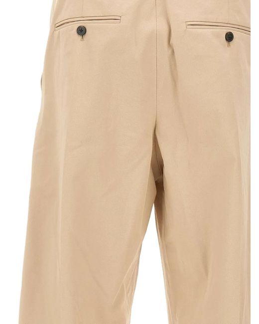 Drole de Monsieur Natural Pleat Logo Patch Trousers for men