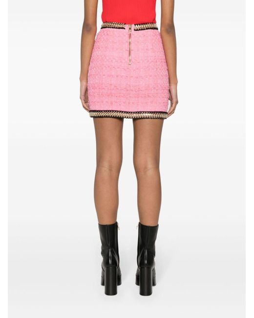 Minigonna in tweed con dettaglio catena di Balmain in Pink