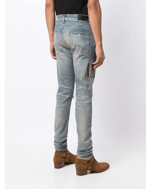 Amiri Blue Light E Ripped Skinny Jeans With Embroidery In Cotton Man for men