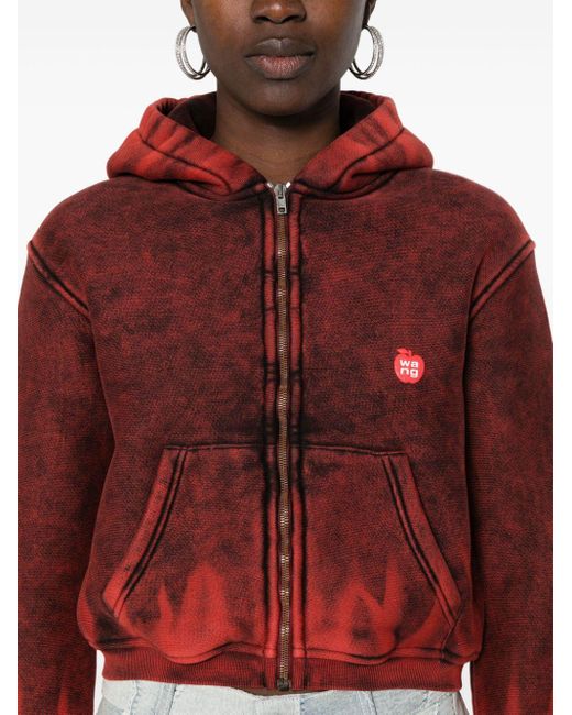 Logo-patch distressed zipped-up hoodie Alexander Wang en coloris Red