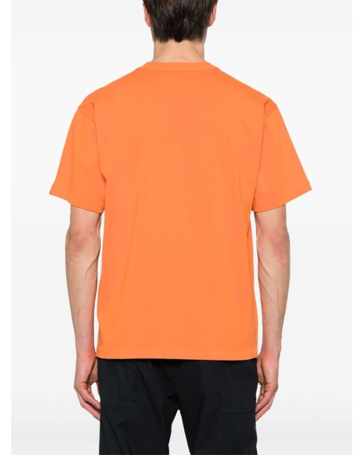 T-shirt en coton à logo en relief Stone Island pour homme en coloris Orange