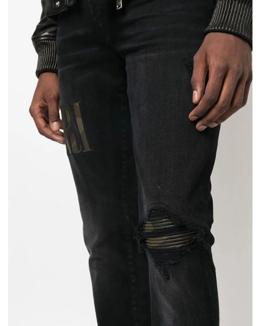 Amiri Black Logo-Appliqué Distressed Jeans for men