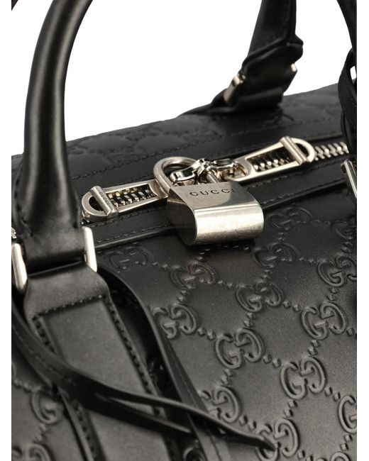 Gucci Black Medium Gg Emblem Embossed Holdall for men