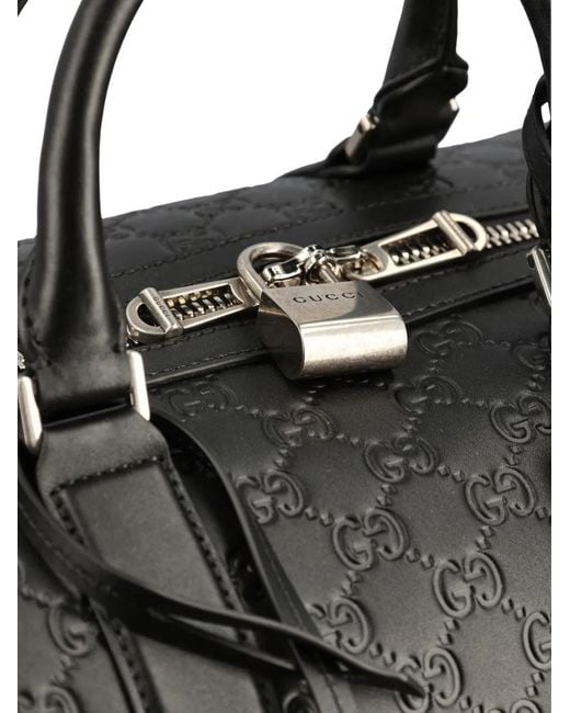 Gucci Black Medium Gg Emblem Embossed Holdall for men