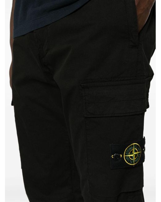Pantaloni con applicazione Compass di Stone Island in Black da Uomo