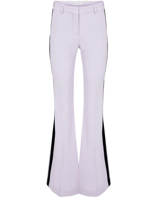 Pantaloni svasati a righe di Nina Ricci in Purple