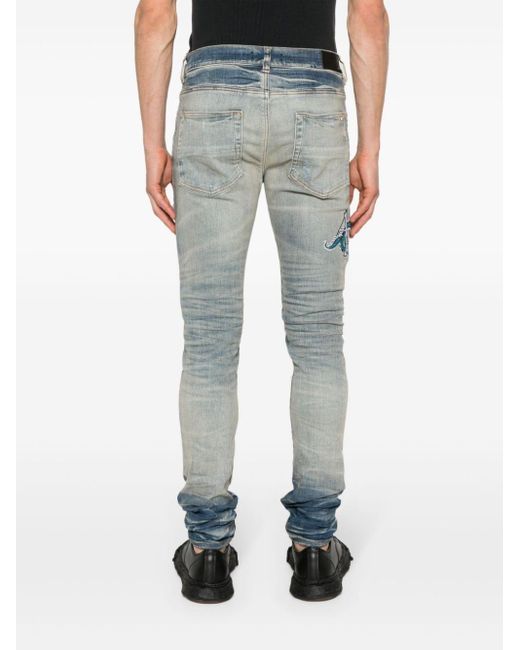 Amiri Blue Logo-appliqué Skinny Jeans for men