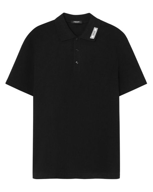 Polo à applique logo Versace pour homme en coloris Black