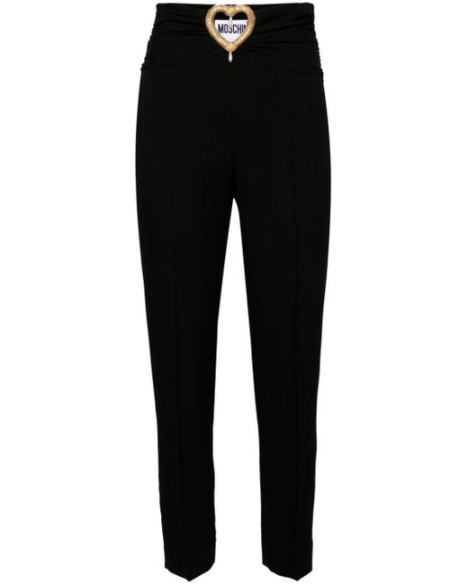 Pantalon à découpes cœur Moschino en coloris Black