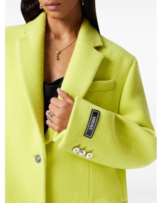Manteau à revers crantés Versace en coloris Yellow