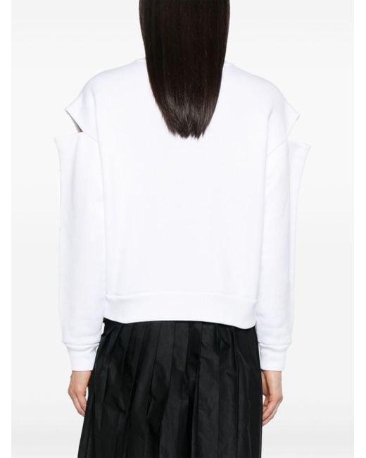 Embroidered logo cut-out sweater Alexander McQueen de color White