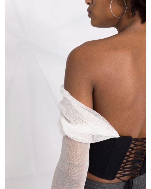 Haut-corset Gigi à manches transparentes MANURI en coloris Black