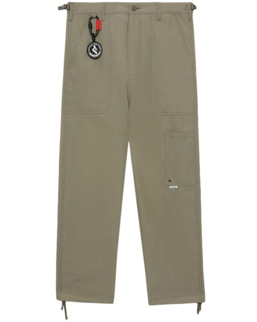Pantalones rectos con aplique del logo Izzue de hombre de color Green