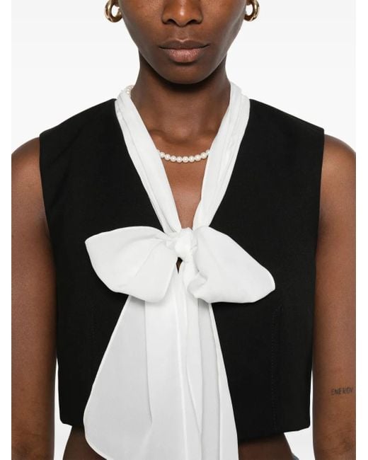 Blusa con cuello en V Sandro de color Black